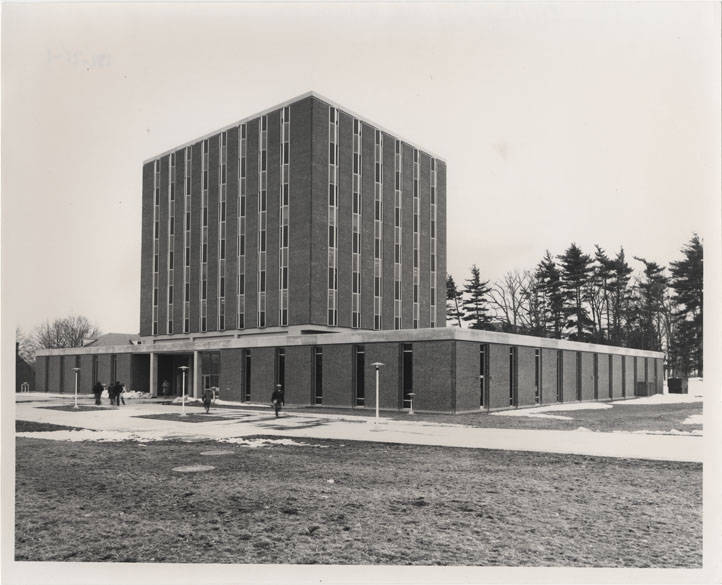 Students walk in front of Kern Building on a snowy day in 1968.