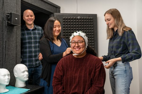 Graduate student researchers in the Center for Language Science prepare to use electrophysiological recording of brain activity to learn about the inner workings of language with a special focus on bilingualism.