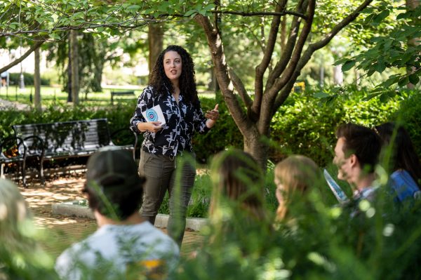 Lauren Halberstadt, assistant teaching professor of Spanish, teaches her Spanish class outside Willard Building.