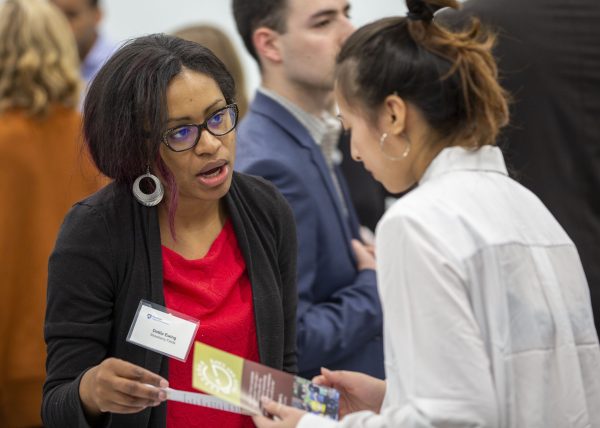 Dottie Ewing (left), a recruiter for Strawberry Fields, Inc., talks to a Liberal Arts student about internship opportunities during Liberal Arts Career Week.