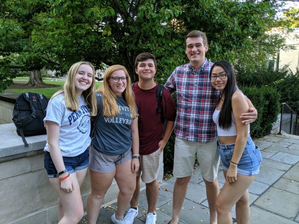 Five Liberal Arts students stand on the Sparks Building patio during the Paterno Fellows Orientation.