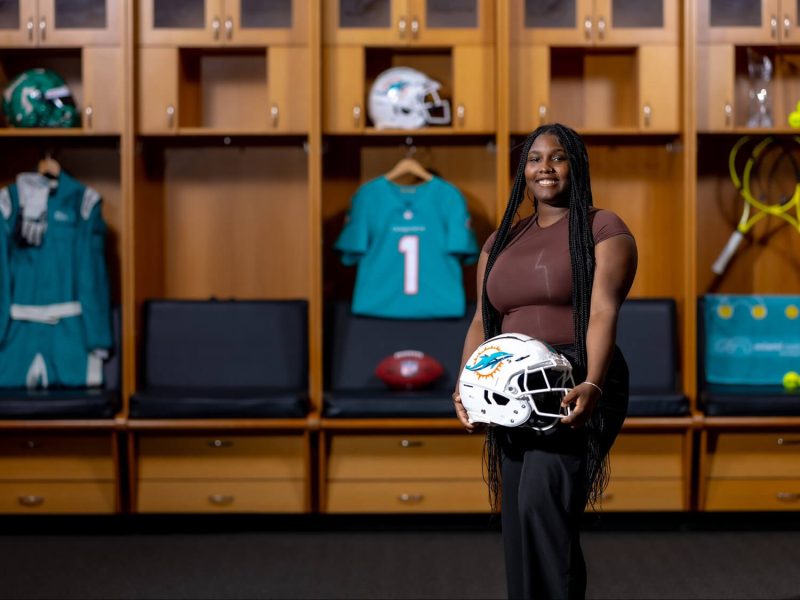 Azziyah LaRue in the Miami Dolphins locker room