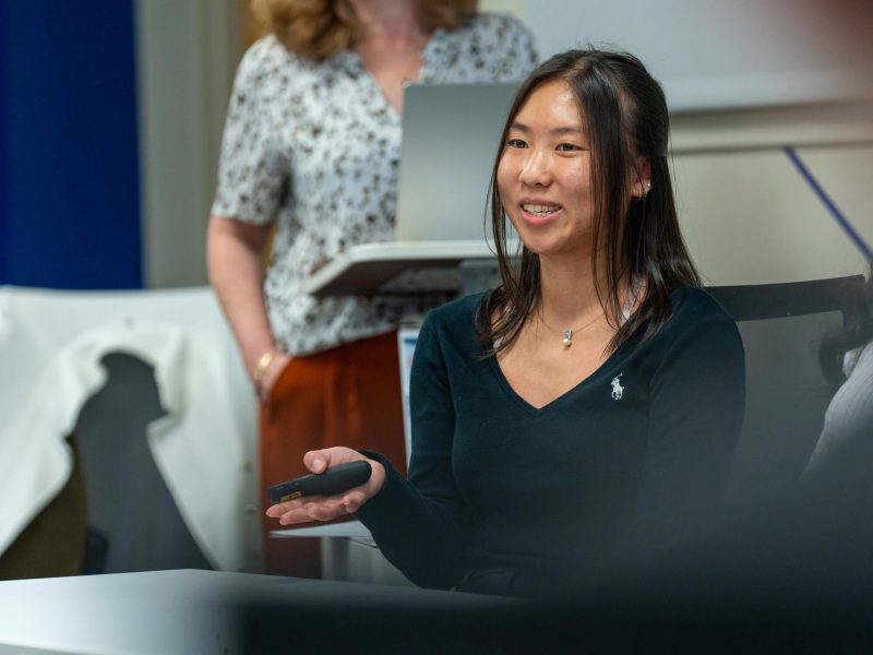 Charis Liu Charis Liu, a 2025 Penn State graduate, makes a presentation wearing a long-sleeve black t-shirt.