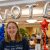 Maddie Hindman stands in front of a balloon arch spelling out “VOTE” in the HUB-Robeson Center.