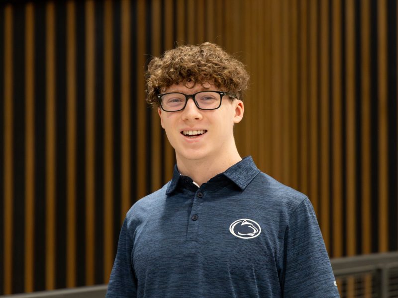 Nick Hotalen Nick Hotalen, who will graduate Penn State in 2026, stands before a brown curtain, wearing a blue Penn State shirt.